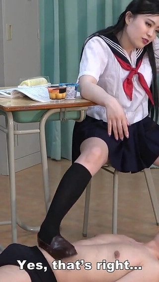 College Girl Stretches Her Legs Under the Desk While Studying and Plays with Teacher's Dick