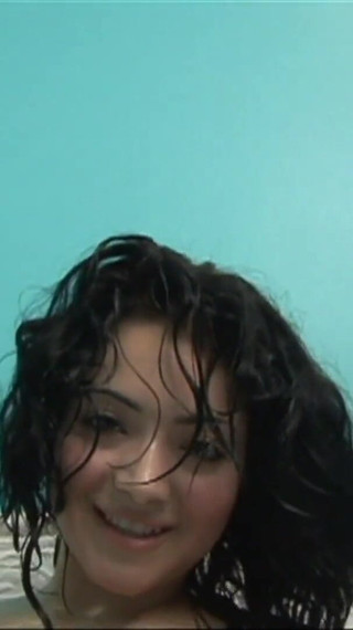 Mora gets excited while taking a hot bath and satisfies her hairy pussy by masturbating it